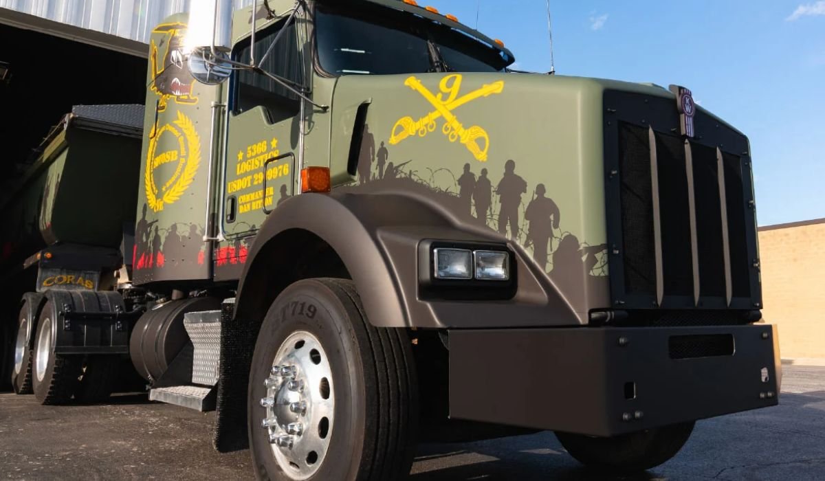 Full vehicle wrap on a white Grasshopper Trucking semi, with green graphics covering the cab and side panels